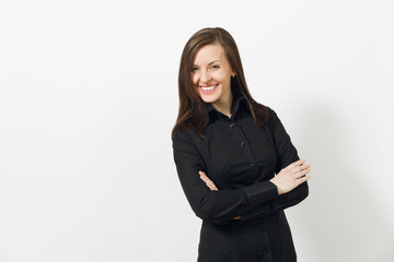 Beautiful happy caucasian young smiling brown-hair business woman in black classic shirt and skirt holding hands crossed isolated on white background. Manager or worker. Copy space for advertisement.