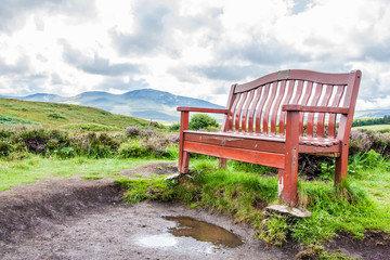Relax on red bench british landscape Scotland