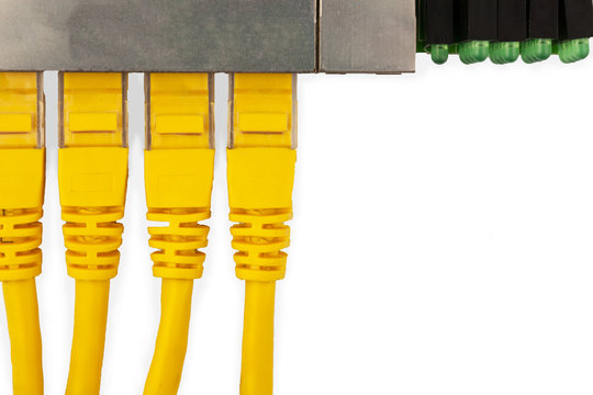 4 yellow UTP patch cords connected in ethernet switch, with top view. Isolated on the white background.