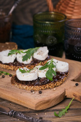 Bruschetta with fig jam, goat cheese and rucola