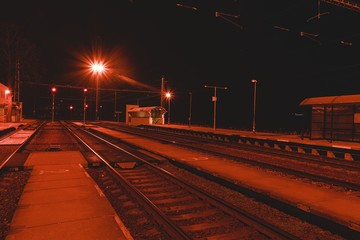 Fototapeta na wymiar Railway station at the night. European railway station.