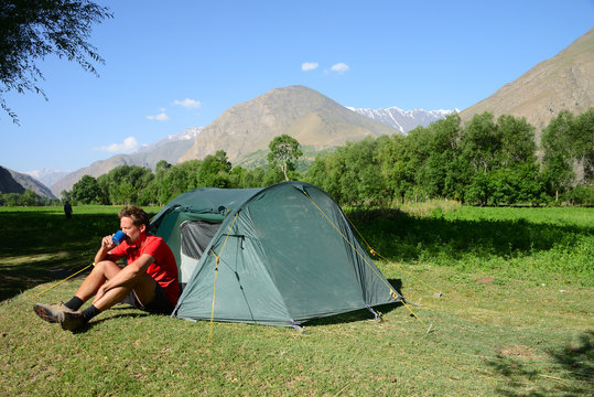 Camping in the Wakhan valley with Afghanistan in the background, Pamir Mountain Range, Tajikistan