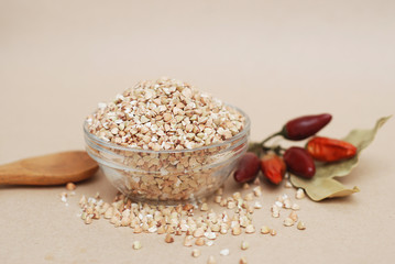 Green Buckwheat isolated in Glass Bowl with spices. Healthy Food Concept.