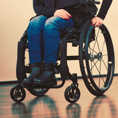 Invalid woman on wheelchair.