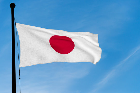 Japan Flag waving over blue sky (3D rendering)