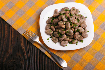 boiled broad beans on a rustic background
