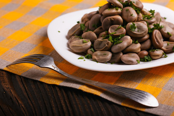 boiled broad beans on a rustic background