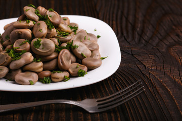 boiled broad beans on a rustic background