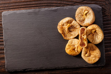Dried figs on a dark rustic background