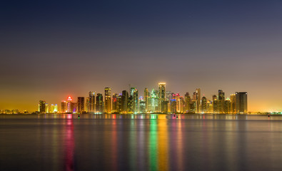 Fototapeta na wymiar Skyline of Doha at night. The capital of Qatar