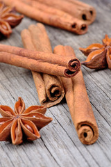 Cinnamon sticks with star anise on wooden table