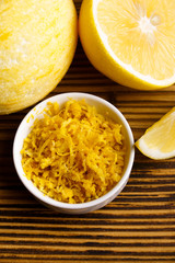 Lemon and juice on a wooden background