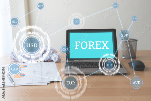 Laptop On Working Table With Text Forex And Currency Connection On - 