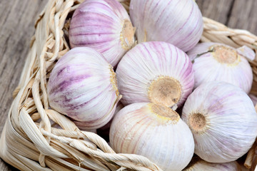 Garlic in a wicker basket on table