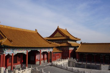 Red temple and yellow roof tops in forbidden city in Beijing China