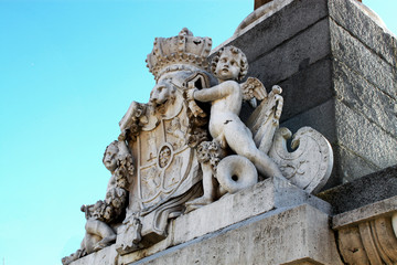 Fototapeta na wymiar An ancient stone coat of arms in Madrid, Spain.