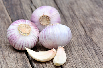Heap of fresh garlic on wooden table