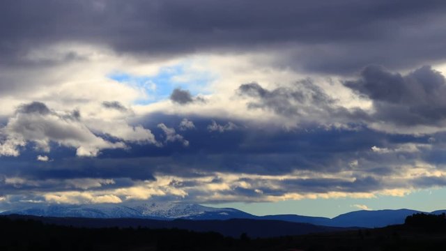 Stormy clouds over Pyrenean mountains moving at high speed
