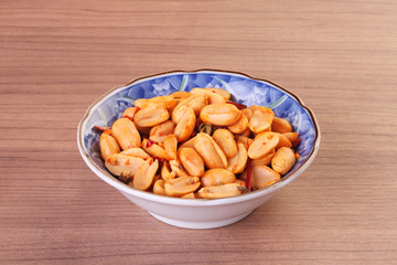 Spicy coated peanuts in the bowl      