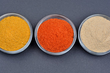 Spices in a bowls on black background