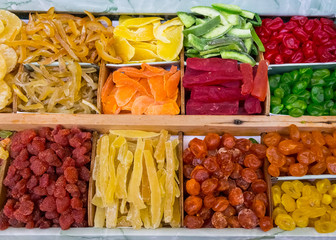 dry fruit mix on food market, coloful dry fruits, dried fruits, different types of dry fruits, Assortment of dried fruits closeup background in square cells. Decorative pattern of dry exotic fruit