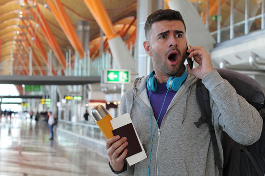 Shocked traveler getting an unexpected phone call
