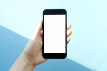 the smart phone holding a woman hand, blank flame