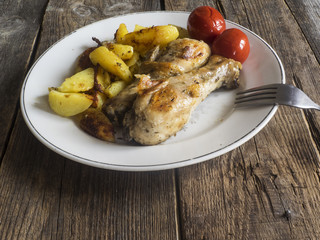 Fried chicken legs with potatoes