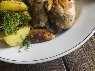 Fried chicken legs with potatoes