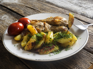 Fried chicken legs with potatoes