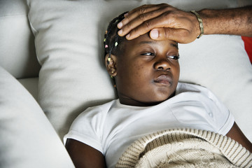 Girl sleeping with sickness on the bed