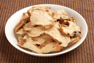 Dried galangal on a plate