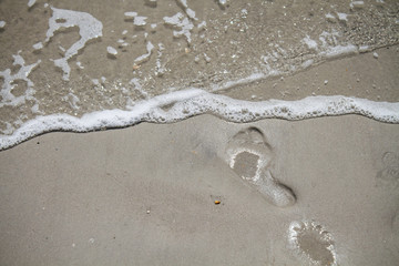 Fototapeta na wymiar Footprints to the Sea