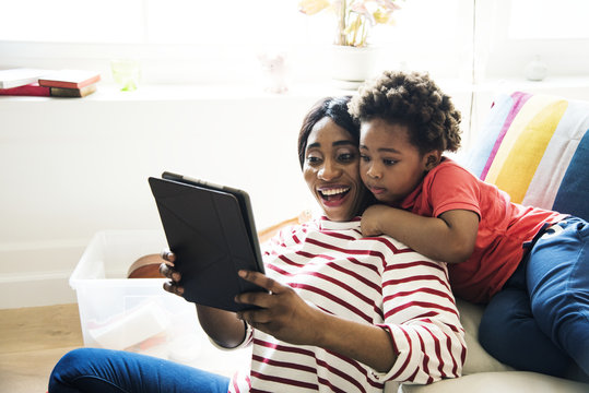 Mom and son using tablet together