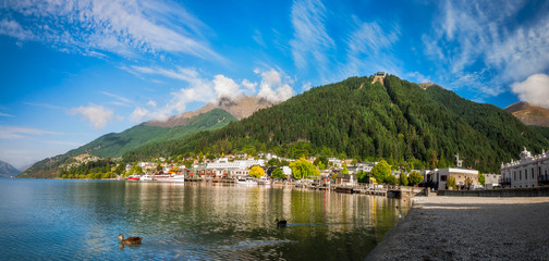 View of the alpine city of Queenstown in New Zealand, from the marina bay of Lake Wakatipu with the...