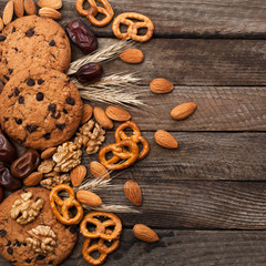 Biscuits and nuts on a wooden background