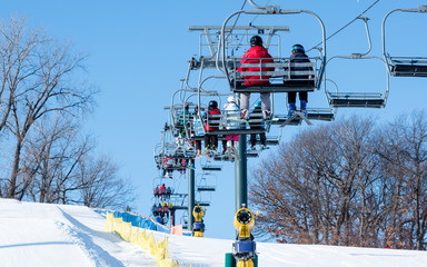 Naklejka premium People are having fun in downhill skiing and snowboarding