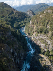 Fototapeta na wymiar Aerial drone view of the beautiful canyon in the Canadian Landscape during a vibrant sunny summer day. Taken in Cheakamus, near Whistler, North of Vancouver, BC, Canada. 