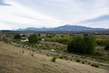 Naklejka premium Lake Tekapo freedom camping van in wilderness New Zealand