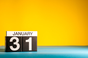 January 31st. Day 31 of january month, calendar on yellow background. Winter time. Empty space for text