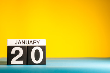 January 20th. Day 20 of january month, calendar on yellow background. Winter time. Empty space for text