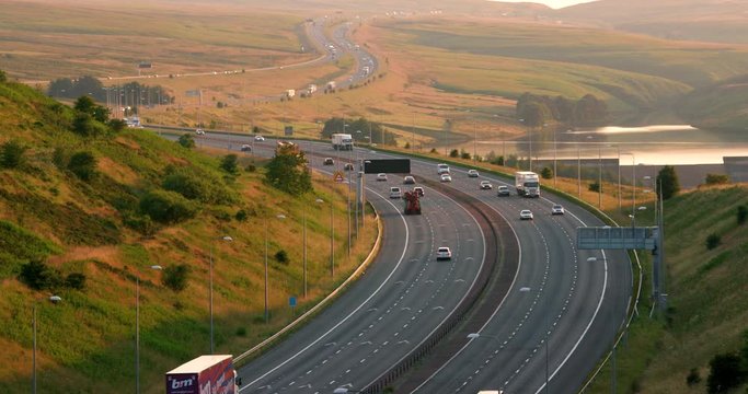 Cars & Lorries On M62 Motorway & Booth Wood Resrvoir; M62 And Reflections; West Yorkshire, England