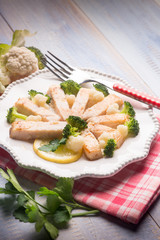 swordfish with broccoli and cauliflower salad, selective focus