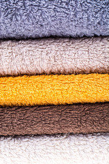 Stack of terry towels on wooden table