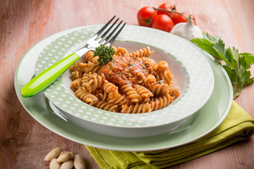 fusilli with almond and tomatoes pesto sauce, selective focus