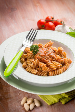 fusilli with almond and tomatoes pesto sauce, selective focus