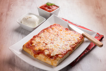 sliced pizza with buffalo mozzarella, selective focus