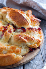 Cake with dried tomatoes and mozzarella, selective focus