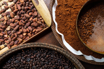 Different types of coffee beans on the plates. Top view