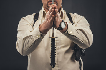 cropped shot of yakuza member holding blade of tanto knife